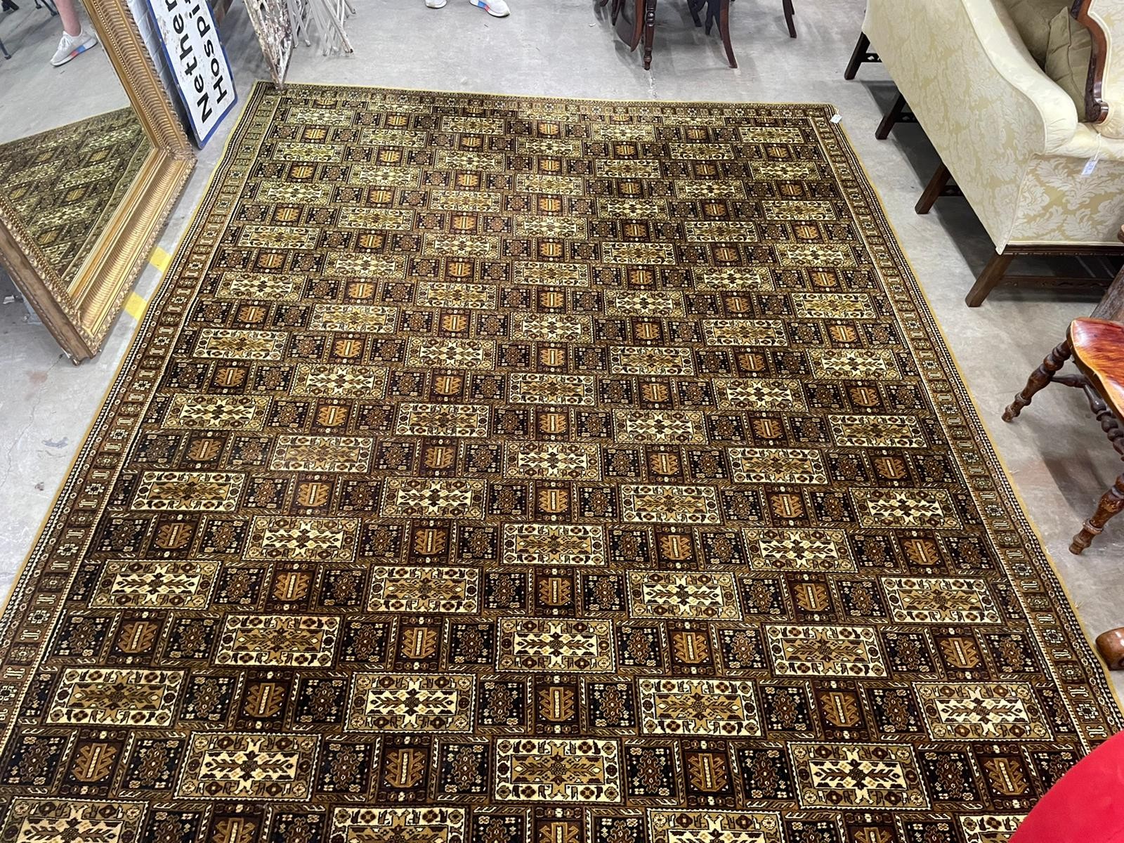 A Wilton machined mustard ground Persian style carpet, 364 x 275cm